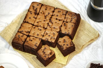 Taiwanese Castella cake. homemade chocolate cake so soft and delicious with ingredient: eggs, cocoa, milk, flour and choco chips sprinkles. bakery concept for background or wallpaper. close up.