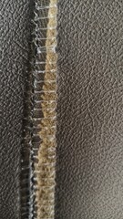 abstract background of broken car seat stitching texture. leather texture. 