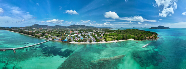 Aerial view Beautiful seashore at Phuket Thailand, beautiful seacoast view and longtail fishing boats in summer season,Nature and Travel background Panorama landscape