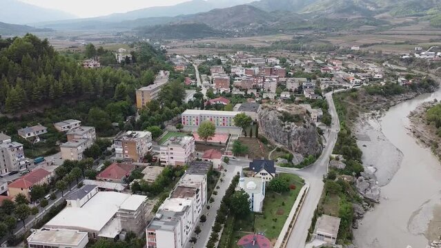 Aerial view of village in Albania, near a river and a rock climbing site