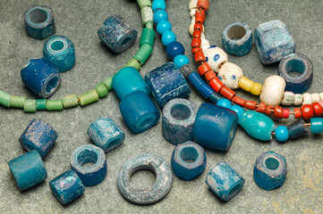 Anceint blue glass beads used as everyday items of adornment, ceremonial costumes and objects of...