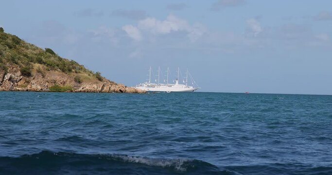 Virgin Gorda Caribbean ocean bay sailing cruise ship from boat. Commonwealth of the United Kingdom, British Virgin Islands. Cruise ship vacation destination. Resort, yacht, sailboat harbor and marina.