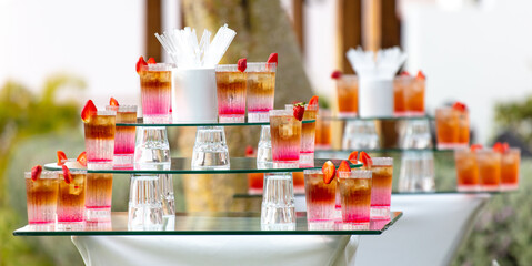 Cocktail with strawberries in nature.