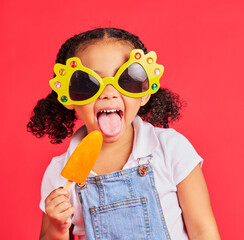 Child, sunglasses or ice cream on isolated red background or tongue, cool or summer fashion clothes. Happy, kid or girl with lolly, cold sweet or funny glasses for sun protection during fun vacation