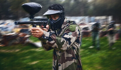 Fototapeta premium Man, paintball or gun aim in motion blur games arena or challenge in teamwork competition, sports or military training. Player, rifle or shooting equipment for soldiers, fast army or battlefield war