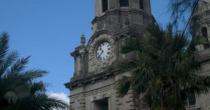Antigua Caribbean St Johns Cathedral clock tower close. St. John's Cathedral, St. John the Divine, the Cathedral Church of the Diocese of North Eastern Caribbean and Aruba.