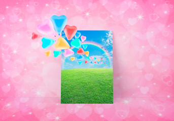 Colorful love heart balloon with green grass field over blue sky, rainbow and birds postcard on light pink heart love bokeh wall, Valentines day concept, 3D rendering