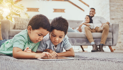 Children with tablet, games or streaming with parents at family home, gaming with technology or video watching. Internet, wifi and childhood, mother and father relax with boys and screen time