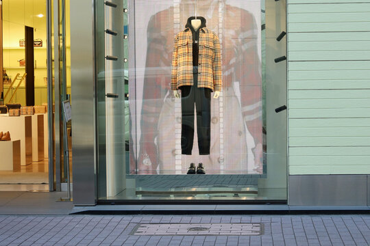 TOKYO, JAPAN - January 26, 2023: Display in a window of a Burberry store in Tokyo's Ginza area.
