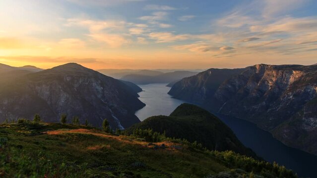 Beautiful sunset over Norwegian fjords and mountains. Shot from the mountain above Stigen mountain-farm, overlooking the spot where Aurlandsfjord and N&aelig;r&oslash;yfjord meets.