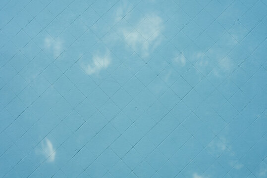 blue painted wall with flashes of light, texture, background