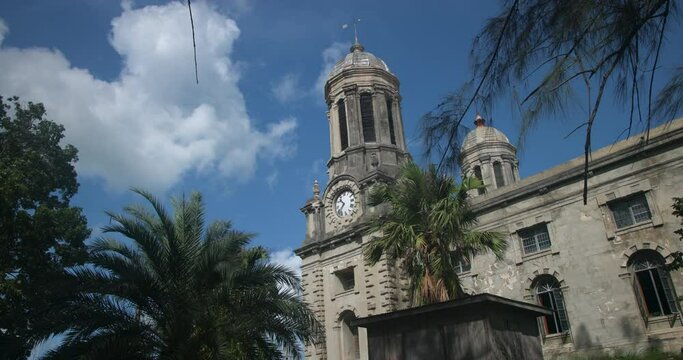 Antigua Caribbean St Johns Cathedral tower clouds. St. John's Cathedral, St. John the Divine, the Cathedral Church of the Diocese of North Eastern Caribbean Aruba. Anglican Church of England religion.