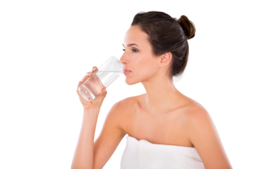 Side view of a beautiful young woman wrapped in a towel and drinking a glass of water Isolated on a PNG background.