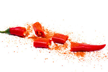 Sliced red chilli or chilli cayenne pepper decorated with chilli powder isolated on white...