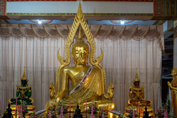 Khon Kaen, Thailand, Jan 13, 2023 : Phra Mahathat Kaen Nakhon (Wat Nong Wang ), Pagoda-style Buddhist temple featuring 9 receding levels topped with a soaring golden spire.