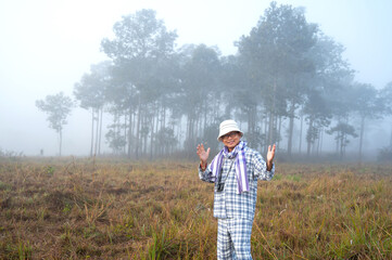 Japanese,Korean Man lost in the fog.Asian man traveling in the winter park.