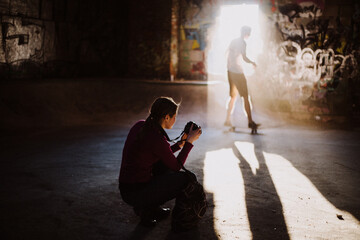 Photographer taking a photo of skateboarder. 