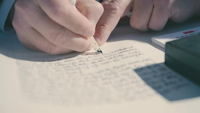 Taking a beautiful video of writing a Torah scroll. A hand writing a Torah scroll. Judaism. Israel. Jerusalem.