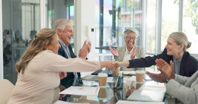 Handshake, partnership and applause of business people in office to celebrate merger deal or b2b collaboration. Welcome, thank you and group of happy employees shaking hands, clapping and laughing.