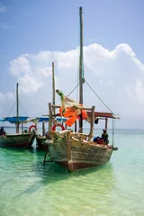 Crédence de cuisine en verre imprimé Plage de Nungwi, Tanzanie Dhow Fishing Boat at low tide on Zanzibar island, Tanzania
