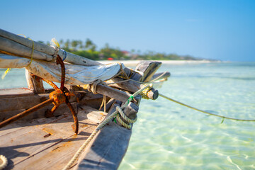 Dhow Fishing Boat at low tide on Zanzibar island, Tanzania - obrazy, fototapety, plakaty