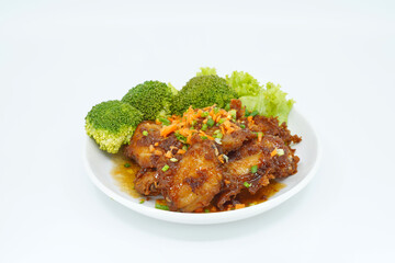 chicken fried with sweet sauce on white dish