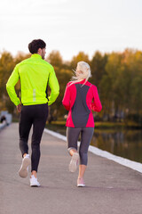 Running Concepts. Urban sports - couple jogging for fitness in the city on a beautiful summer day