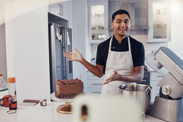 Man, chef and talking in kitchen on vlog, live streaming and recording a cake dessert tutorial on...