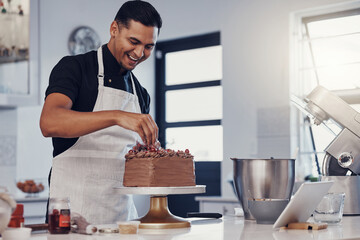 Chef, baking and cake with chocolate in a kitchen by a happy man preparing a sweet desert or a birthday. Decoration, baker or cook with a small business smiling and cooking dessert at a bakery - Powered by Adobe