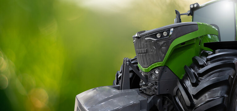 Agricultural tractor on green background