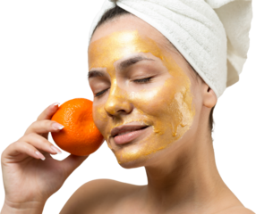 Beauty portrait of woman in white towel on head with gold nourishing mask on face. Skincare cleansing eco organic cosmetic spa relax concept. A girl stands with her back holding an orange mandarin.