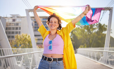 Portrait, pride and lesbian woman with flag on city bridge, lgbtq community, identity with support...