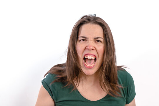 Furious Woman Looking At The Camera Showing Her Teeth