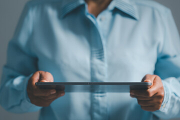 Woman person hands with digital tablet on dark for business or technology background.