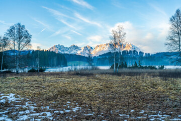 Fototapeta na wymiar Wintry landscape with view of Alps near Schwarzsee lake in Kitzbuhel. Winter in Austria