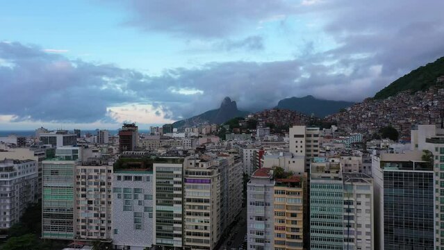 Copacabana and Ipanema Neighborhoods. Cantagalo and Pavao-Pavaozinho Favelas. Rio de Janeiro, Brazil. Aerial View. Drone Flies SIdeways and Upwards