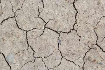 The ground has cracks in the top view for the background or graphic design with the concept of drought and death