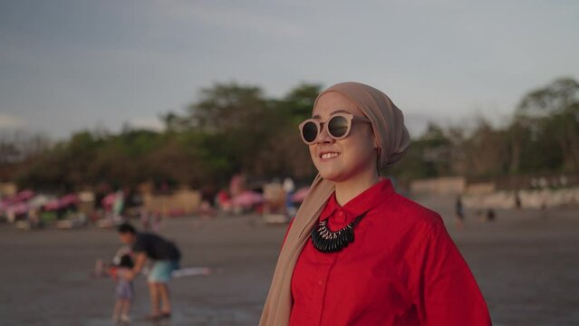 Modern Indonesian Muslim Woman on Hijab - Portrait, Smiling, looking to The Sunset. Optimistic Hopefull