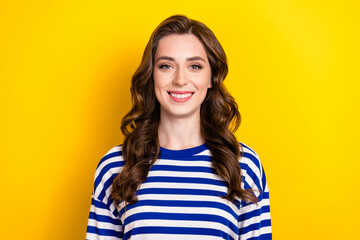 Photo of adorable sweet girl dressed striped pullover smiling showing white teeth isolated yellow color background