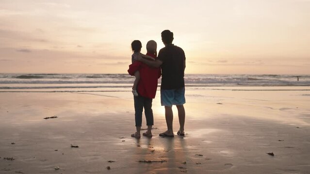 Happy Modern Muslim Indonesian Family Enjoy Sunset Beach Slow Motion