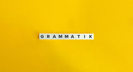 Grammatik in German Language. Letter Tiles on Yellow Background. Minimal Aesthetics.