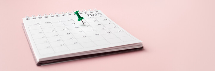 Calendar 2023 with pinned date on pastel pink background