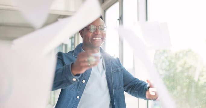 Creative black man, smile and throwing papers in celebration, victory or accomplishment walking in office. Happy African American employee male smiling or celebrating paperwork for startup completion