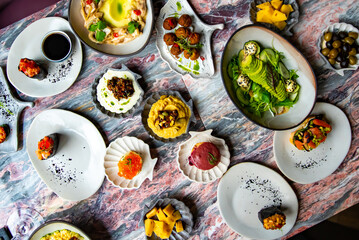 variety of restaurant dishes on table