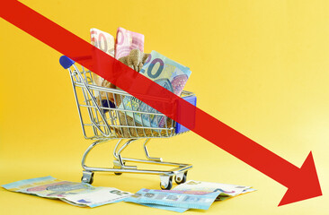 Economic concept. Crisis, loss of purchasing power, decline with no option to save. Shopping cart...