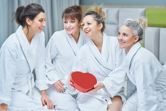 Picture of four girls wearing bathrobe with heart