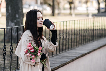 Self care and self love, Take a break. Take time to appreciate the simple things in life. Young woman Take a break from daily routine to enjoy cup of coffee and the beauty of tulips.