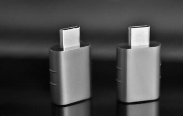 Two usb adapters, black and white