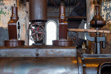 Fragment of steam engine from 1903. Important part of technological line in historical factory....