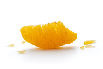 Peeled orange fruit pulp isolated on white background. Macro photo of citrus fruit slice. Fresh, juicy pulp of orange